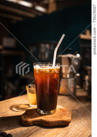 Iced coffee in a cup,Pouring coffee into the cup 73629087