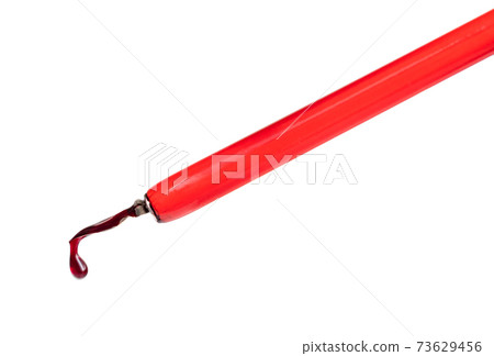 big red ink drop is hanging on the tip of dip pen big red ink drop is hanging on the tip of dip pen 73629456