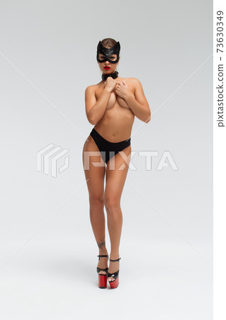 Sexy topless woman in black mask 73630349