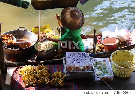 A woman selling fruit at the Ayutthaya floating market A woman selling fruit at the Ayutthaya floating market 73630865