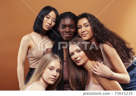 SaveDownload Previewyoung pretty asian, caucasian, afro woman posing cheerful together on brown background, lifestyle diverse nationality people concept SaveDownload Previewyoung pretty asian, caucasian, afro woman posing cheerful together on brown background, lifestyle diverse nationality people concept 73631235
