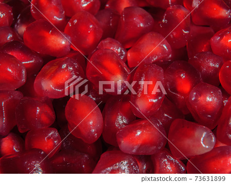 The grain of pomegranate is close-up. Super macro. The grain of pomegranate is close-up. Super macro. 73631899