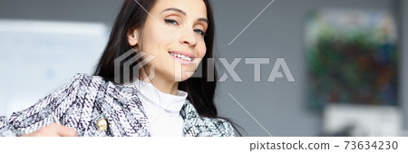 Young manager holds folder in his hands and smiles 73634230