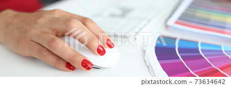 Female hands with manicure works at the computer 73634642
