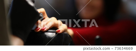 The master in the salon does hardware manicure The master in the salon does hardware manicure 73634669