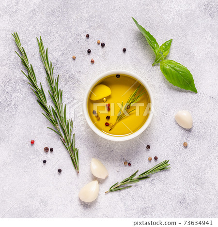 Herbs and condiments on light stone background. Herbs and condiments on light stone background. 73634941