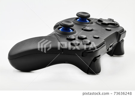 Gamepad on a white background. Game Joystick. Closeup, selective focus 73636248
