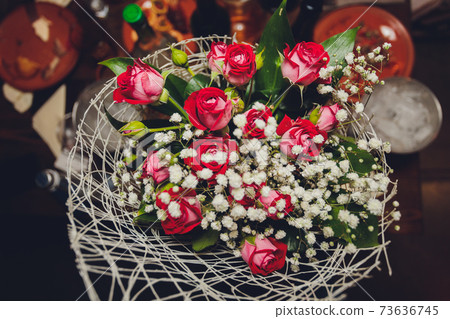 A flower bouquet with a lot of different flowers. A flower bouquet with a lot of different flowers. 73636745