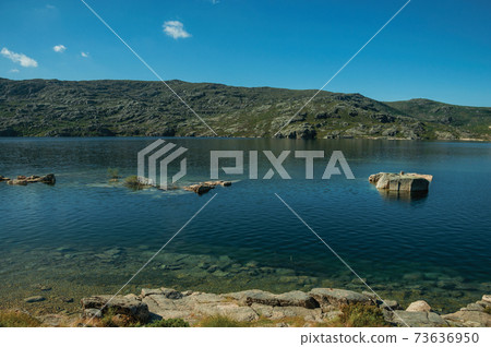 Blue fresh water at the Long Lake on highlands Blue fresh water at the Long Lake on highlands 73636950