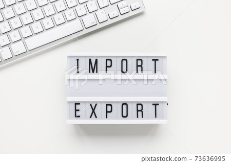 Text IMPORT EXPORT and computer keyboard on white Text IMPORT EXPORT and computer keyboard on white 73636995