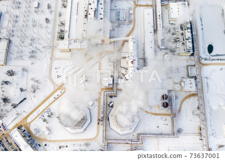 Thermal power plant in winter in the city of Minsk. Smoke is coming from the big Chimneys Thermal power plant in winter in the city of Minsk. Smoke is coming from the big Chimneys 73637001