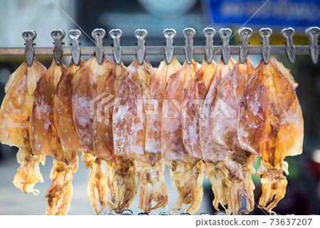 dry squid hanking on roll of street food in asia dry squid hanking on roll of street food in asia 73637207