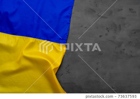 Flag of Ukraine on dark grey background Flag of Ukraine on dark grey background 73637593