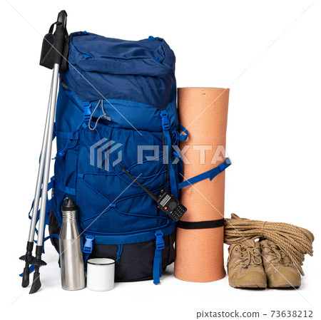 Blue hiking backpack with fitness mat isolated on white 73638212