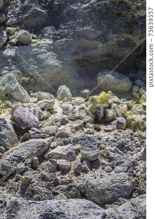 Close-up photo of a rocky area where sulfur crystallized Close-up photo of a rocky area where sulfur crystallized 73639357