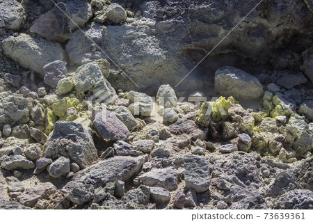 Close-up photo of a rocky area where sulfur crystallized 73639361