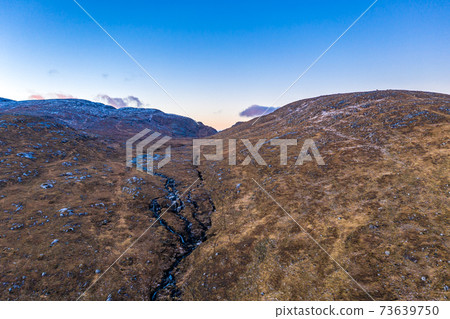 Aerial view of the Glenveagh National Park in County Donegal, Ireland 73639750