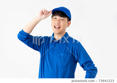 Courier man with a smile on a white background 73642323