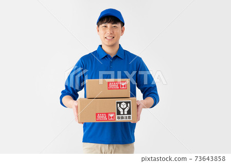 A smiling courier man on a white background with luggage A smiling courier man on a white background with luggage 73643858