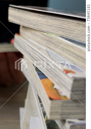 A pile of comic books A pile of comic books 73645181