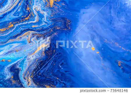 fluid art painting background. Spilled blue, white and gold acrylic paint. Liquid marble Alcohol ink 73648146