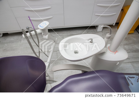 Dental chair for patients, next to the sink Dental chair for patients, next to the sink 73649671