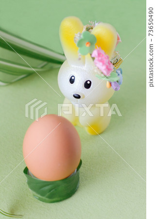 easter celebration concept. toy bunny and egg on grass. happy easter and spring project. 73650490
