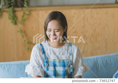 Laughing housewife 73652747