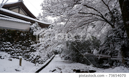 Snowy day Yoshi Taisha Shrine Anō-shu stone wall 73654070
