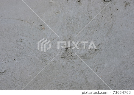 Gray concrete floor texture background . Unfinished rough stucco Gray concrete floor texture background . Unfinished rough stucco 73654763