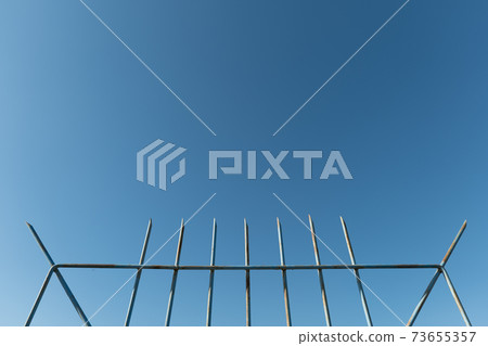 An object with a blue sky and thorns An object with a blue sky and thorns 73655357