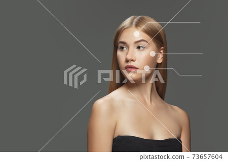 Beautiful female face with lifting up arrows isolated on grey background 73657604