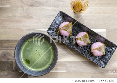 Green tea and cherry rice cake Green tea and cherry rice cake 73659380