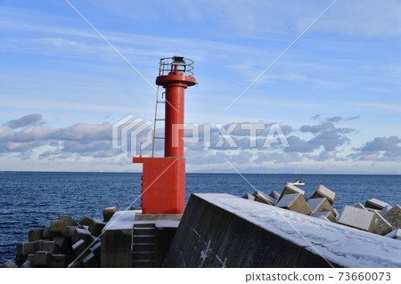 Photographing the snow scene of the lighthouse at Ofune fishing port in Hakodate, Hokkaido in winter 73660073