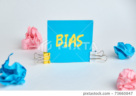 Abstract inscription bias on a blue sticker. 73660847