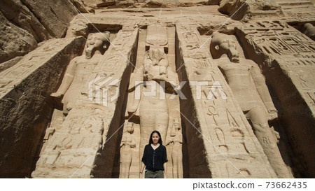 Happy Asian tourist woman travel to Egypt Abu Simbel internation historic handmark 73662435