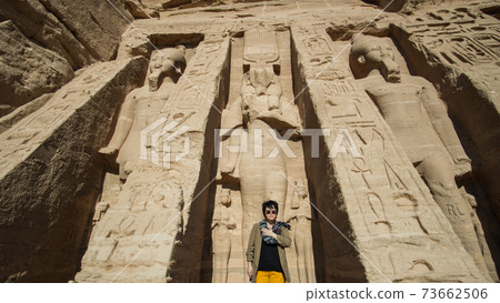 Happy Asian tourist woman travel to Egypt Abu Simbel internation historic handmark 73662506