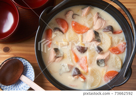 Salmon and root vegetable soup 73662592