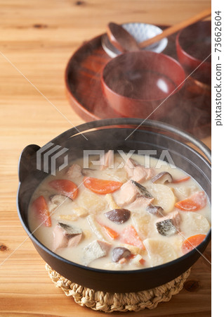 Salmon and root vegetable soup Salmon and root vegetable soup 73662604