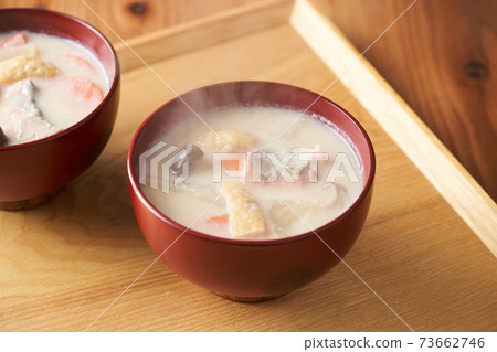 Salmon and root vegetable soup served in a bowl Salmon and root vegetable soup served in a bowl 73662746