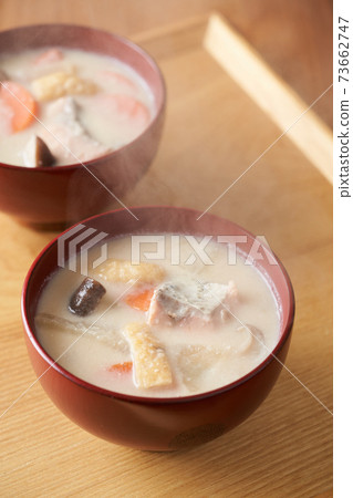 Salmon and root vegetable soup served in a bowl Salmon and root vegetable soup served in a bowl 73662747