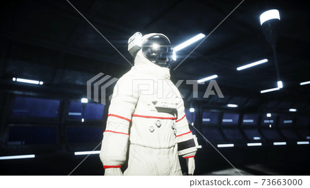 alone astronaut in futuristic space corridor, room. view of the earth. 3d rendering. alone astronaut in futuristic space corridor, room. view of the earth. 3d rendering. 73663000