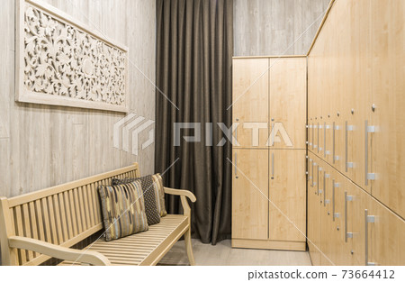 Dressing room interior with wardrobe and bench Dressing room interior with wardrobe and bench 73664412