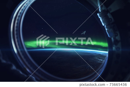 Natural phenomenon of Northern Lights (Aurora Borealis) related to the earth's magnetic field. Elements of this image furnished by NASA 73665436