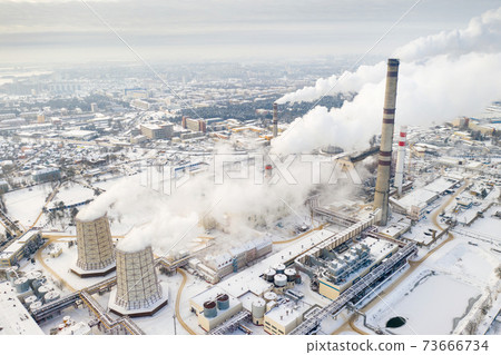 Thermal power plant in winter in the city of Minsk. Smoke is coming from the big Chimneys Thermal power plant in winter in the city of Minsk. Smoke is coming from the big Chimneys 73666734