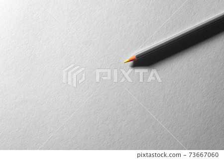 Colored pencil on blank white textured surface. Drawing tools in art studio. Colored pencil on blank white textured surface. Drawing tools in art studio. 73667060
