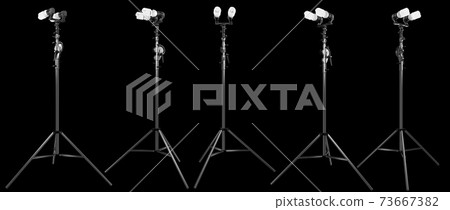 Lightbulb in lamp holder on studio stand isolated on black background Lightbulb in lamp holder on studio stand isolated on black background 73667382