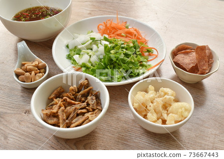 ingredient of crispy fish with pork couple maw topping peanut in spicy and sour chili sauce salad on plate ingredient of crispy fish with pork couple maw topping peanut in spicy and sour chili sauce salad on plate 73667443