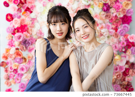 Beautiful woman surrounded by roses Beautiful woman surrounded by roses 73667445