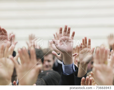 Business Crowd Raising Hands Business Crowd Raising Hands 73668943